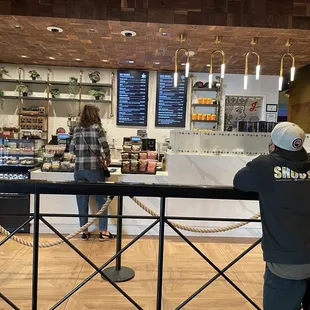 a man and a woman standing at the counter