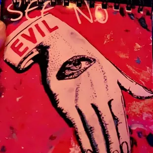 a hand holding a drink