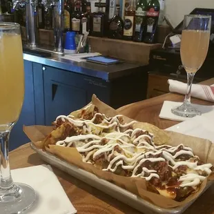 Mimosas, biscuit nachos. Hardwood bar top