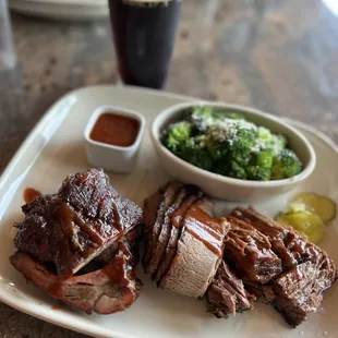 Three meat plate with pork ribs, beef brisket, and burnt ends.