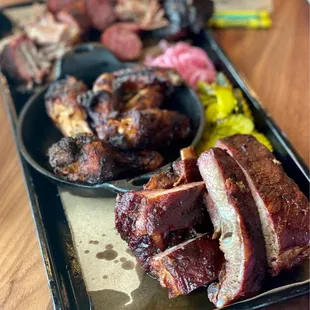 a tray of ribs and sides