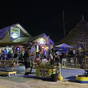 Tiki, outside seating, cornhole