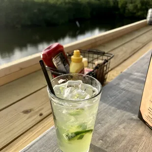 a glass of limeade on a table