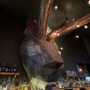 a man standing in front of a bar