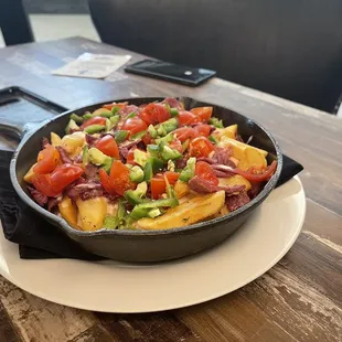 a skillet of food on a table