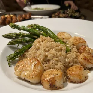 Seared Scallops and Lemon Risotto. The risotto was not citrus-y at all and had a very rich taste. Very beautifully done.
