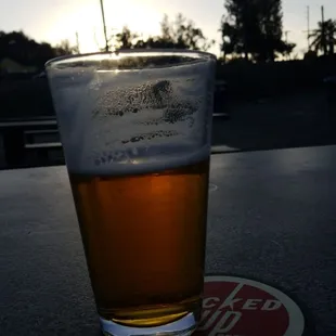 a glass of beer on a table