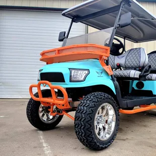 a golf cart parked in front of a garage