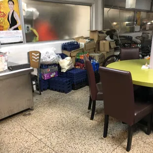 a kitchen with a table and chairs