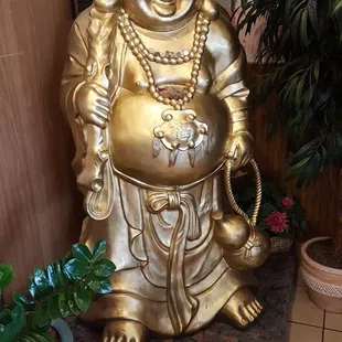 a statue of a laughing buddha