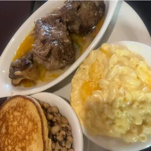 Oxtails 
Mac and Cheese 
Purple Hull Peas
Hot water cornbread