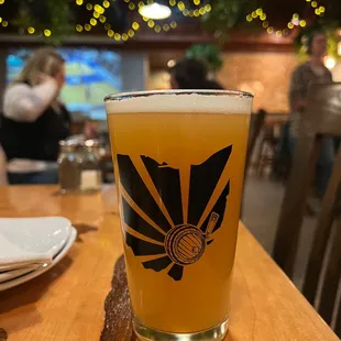 a glass of beer on a table