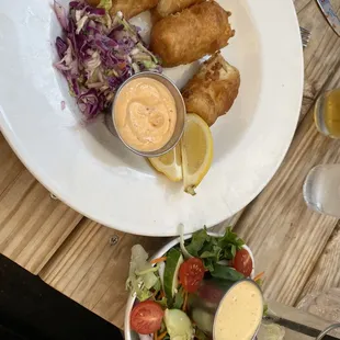 Fish and chips dinner with salad instead of fries. Homemade tartar and slaw, fresh and crisp salad, fish with a crunchy batter breading.