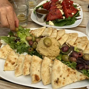 Homemade hummus tray light and refreshing starter. Hummus wasn&apos;t too oily like the store bought kind it was fresh Mediterranean style