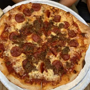 Neanderthal pizza with bacon, sausage, and pepperoni. The generous toppings made this a table favorite!