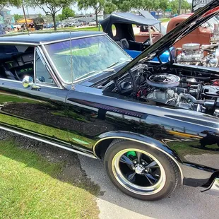 Antique car show in front of restaurant