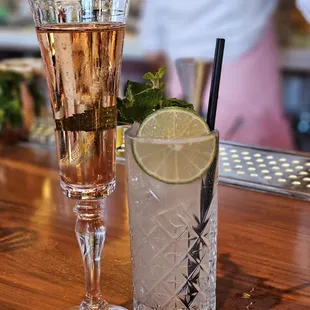 two cocktails on a bar