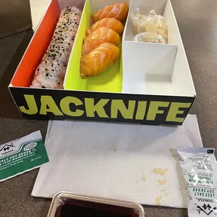 Salmon sushi, the soy sauce tray (so cute) and some delicious roll I&apos;m forgetting what it was! Sorry!