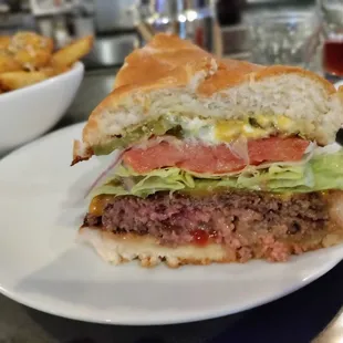 a hamburger with lettuce and tomato