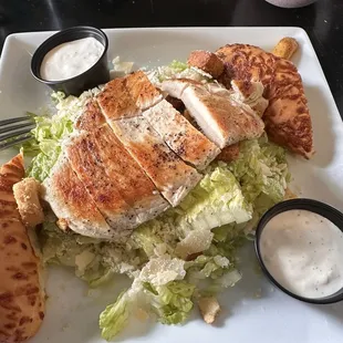 Grilled chicken Caesar salad with garlic cheesy bread