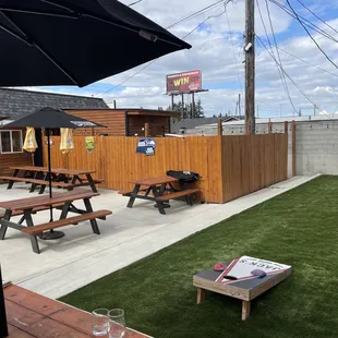 a picnic area with tables and umbrellas