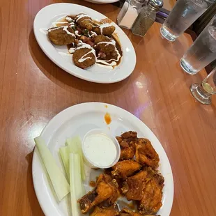 Full size appetizer chicken wings and jalapeño poppers