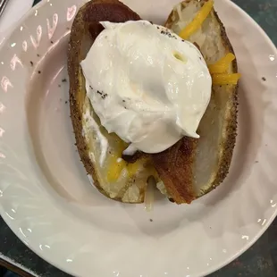 Baked potato with bacon, cheese, sour cream toppings