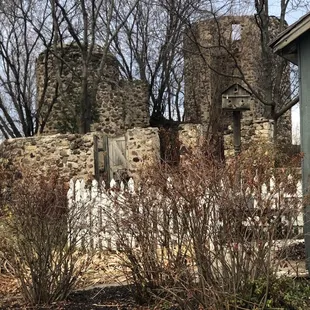a stone wall and a cemetery