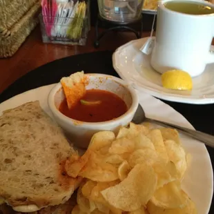 Tomato soup with sliced beef sandwich.