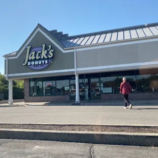 a man walking in front of the store