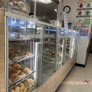 a display case filled with donuts