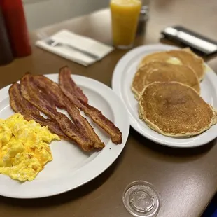 Eggs with cheese, bacon,  Pancakes &amp; orange juice.