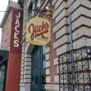 a brick building with a sign for jack&apos;s firehouse