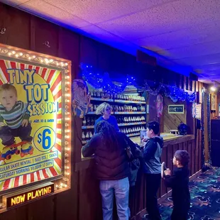 Skate rental area and advertisement for $6 Tiny Tot days (Sat mornings from 1030-1230p.