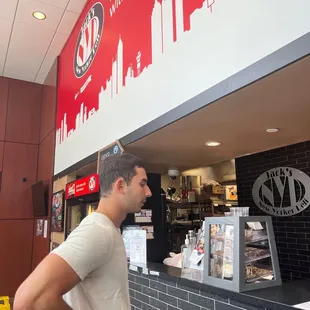 a man standing in front of the counter