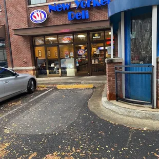 a car parked in front of the store