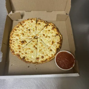 9" cheese pizza with garlic sauce instead pizza sauce. + side cup of pizza sauce