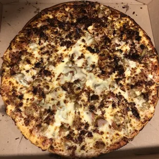 This is the meat lovers well done. I'm not sure where burnt was mentioned as being what is considered well done... ‍‍