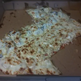 a slice of cheese pizza in a box