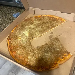 a half eaten pizza in a box