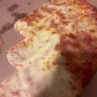 a half eaten pizza in a box