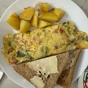 House omelet. Nicely done the way my gramma used to make it.  Charred on the ends like the way the French hate it.