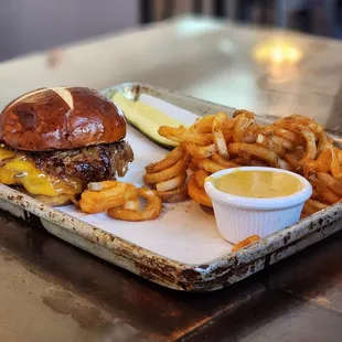 Pretzel burger with curly fries