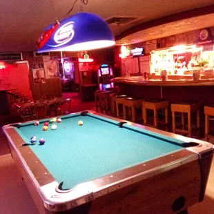 a pool table and bar