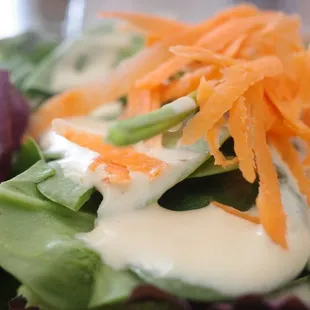 Mix greens with thousand island dressing