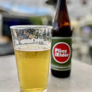 a glass of beer and a bottle of beer