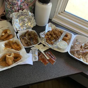 Left to right: potato salad, hush puppies, yams, fried whiting, pig feet, fried okra, slaw, turkey wings with gravy &amp; rice.