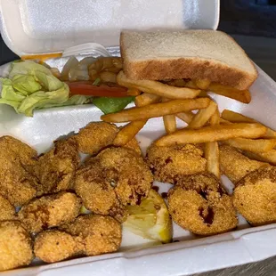 a tray of fried fish and fries