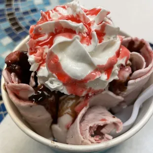 Strawberry ice cream with hot fudge, delicious