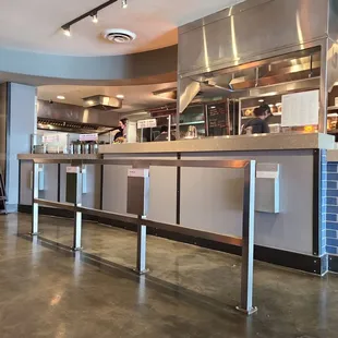 a kitchen with stainless steel counter tops
